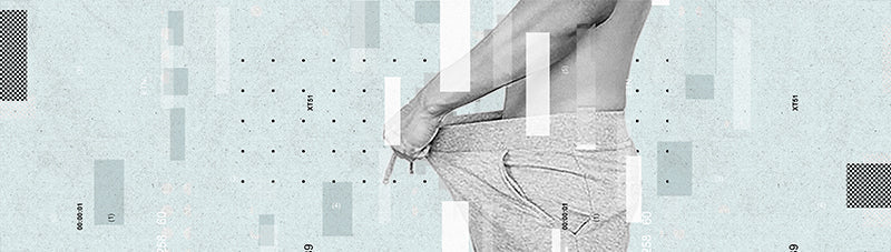 a man looking inside his pants